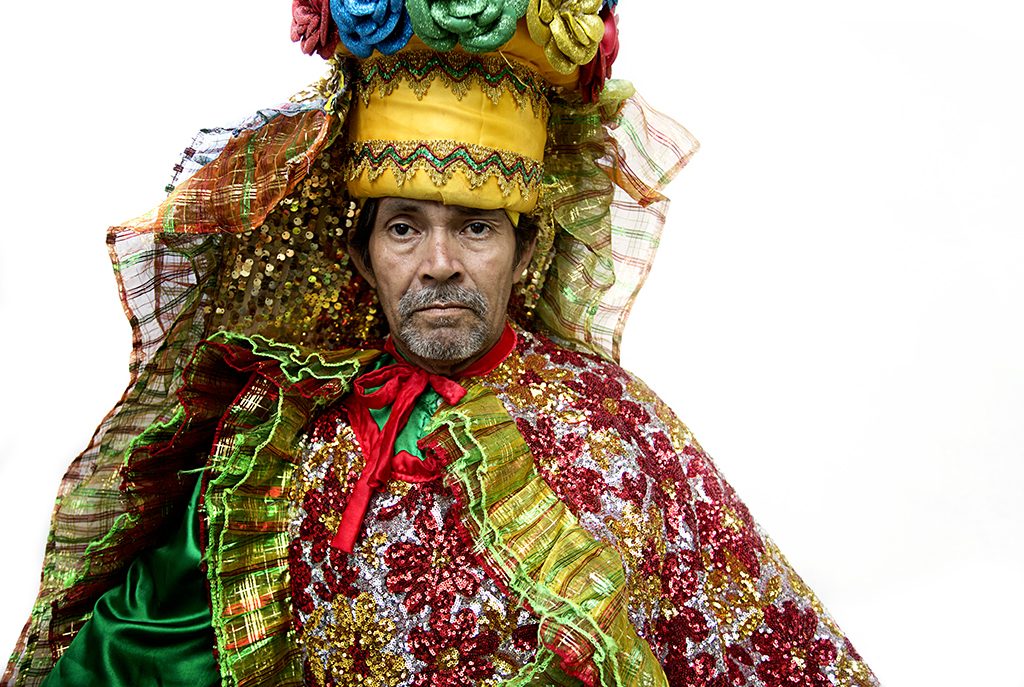 A performer in full feathered carnival costume in Barranquilla