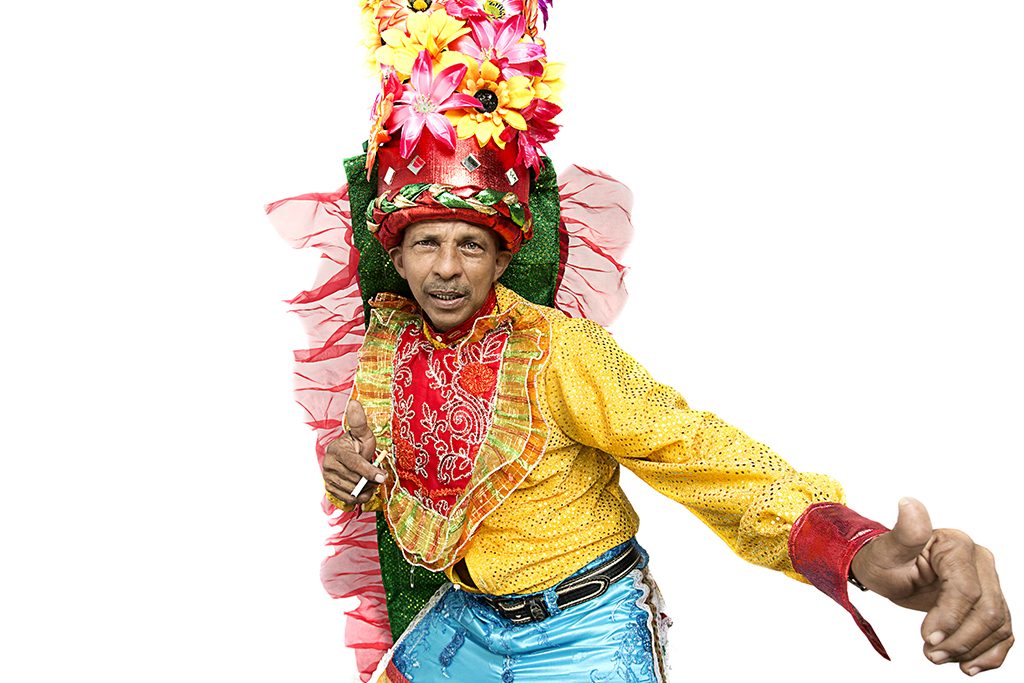 A dancer in a bright yellow-and-red costume