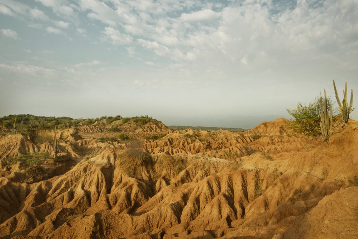 Eroded desert badlands under a wide sky