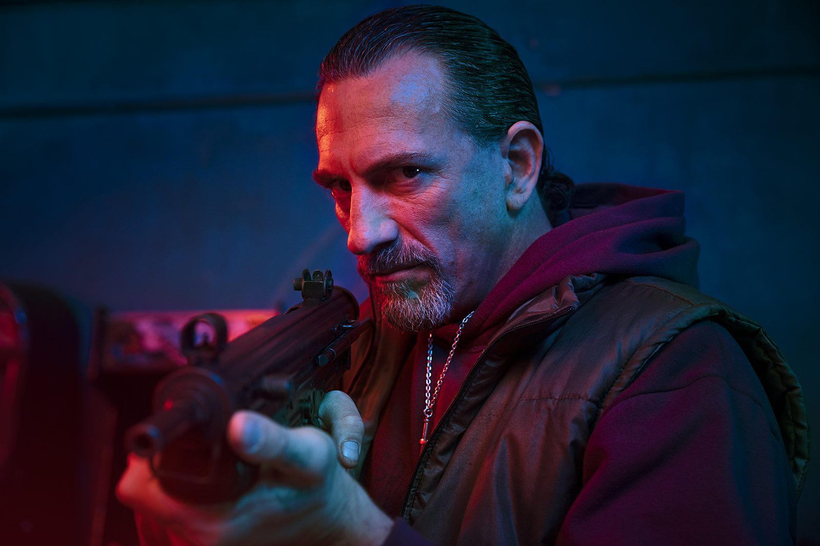 A tense character portrait in deep shadow