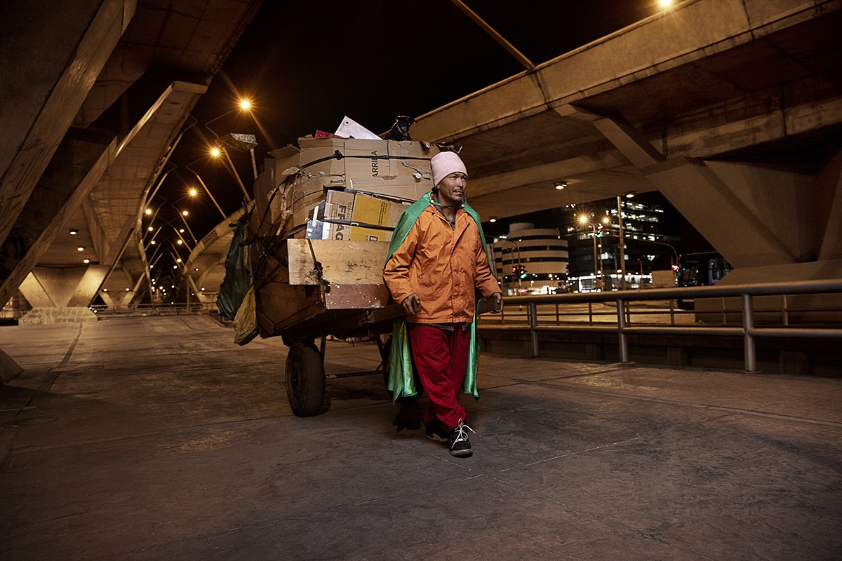 Hauling a full cart out from under a concrete overpass at night