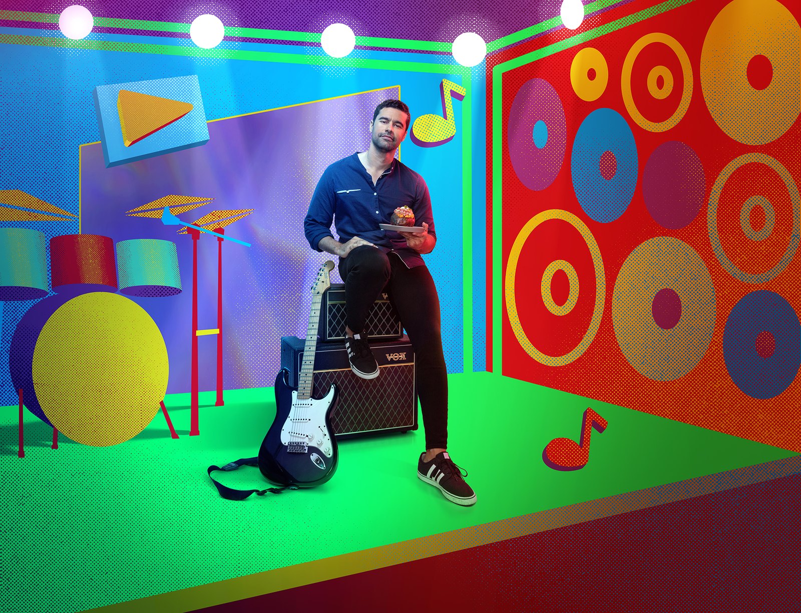 A man with an electric guitar in a neon green and magenta room scattered with drawn music notes