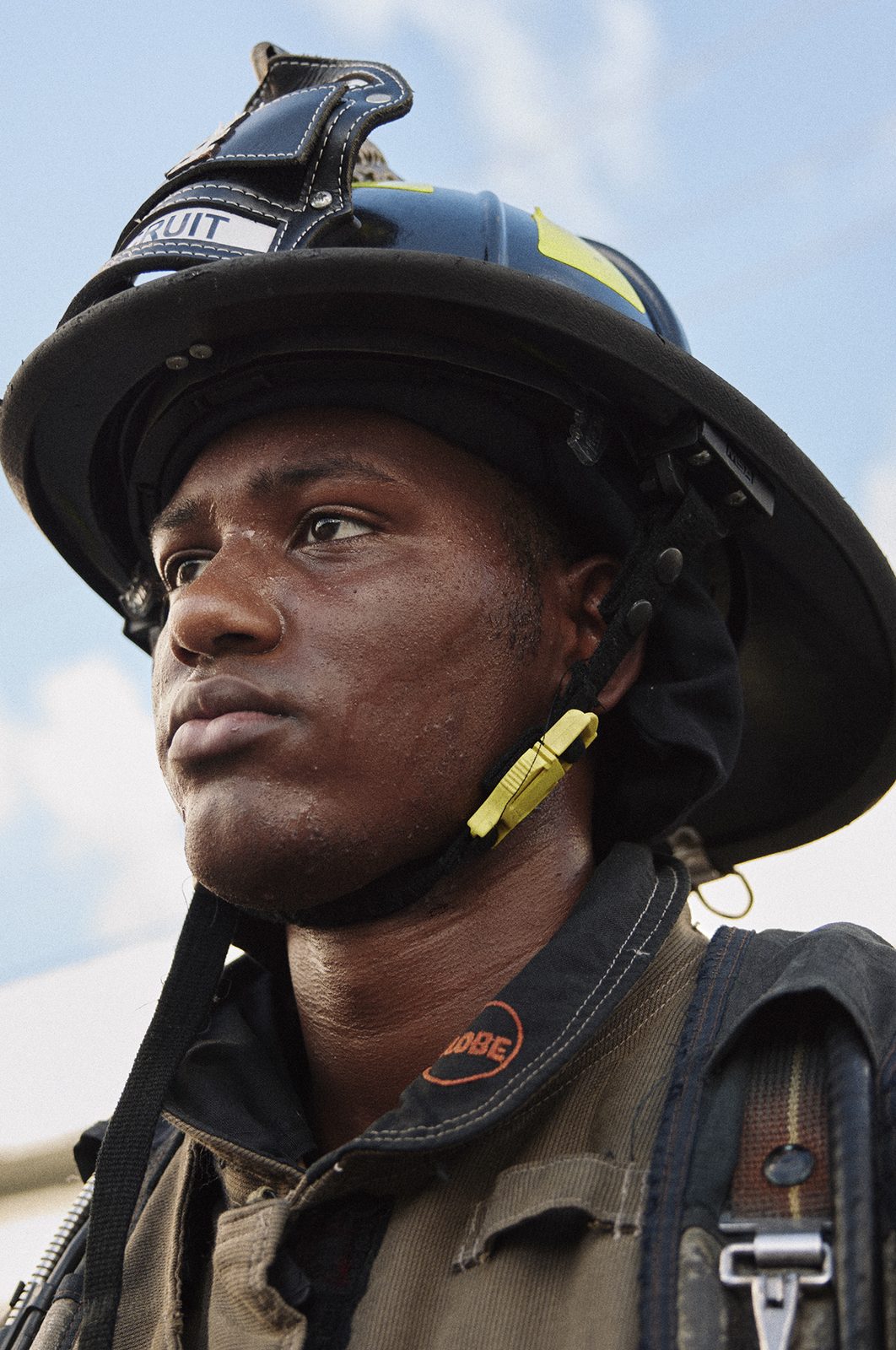 Young firefighter in full turnout gear
