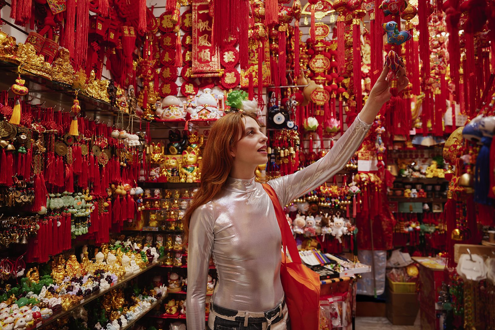 A bright red Chinatown shopfront full of trinkets