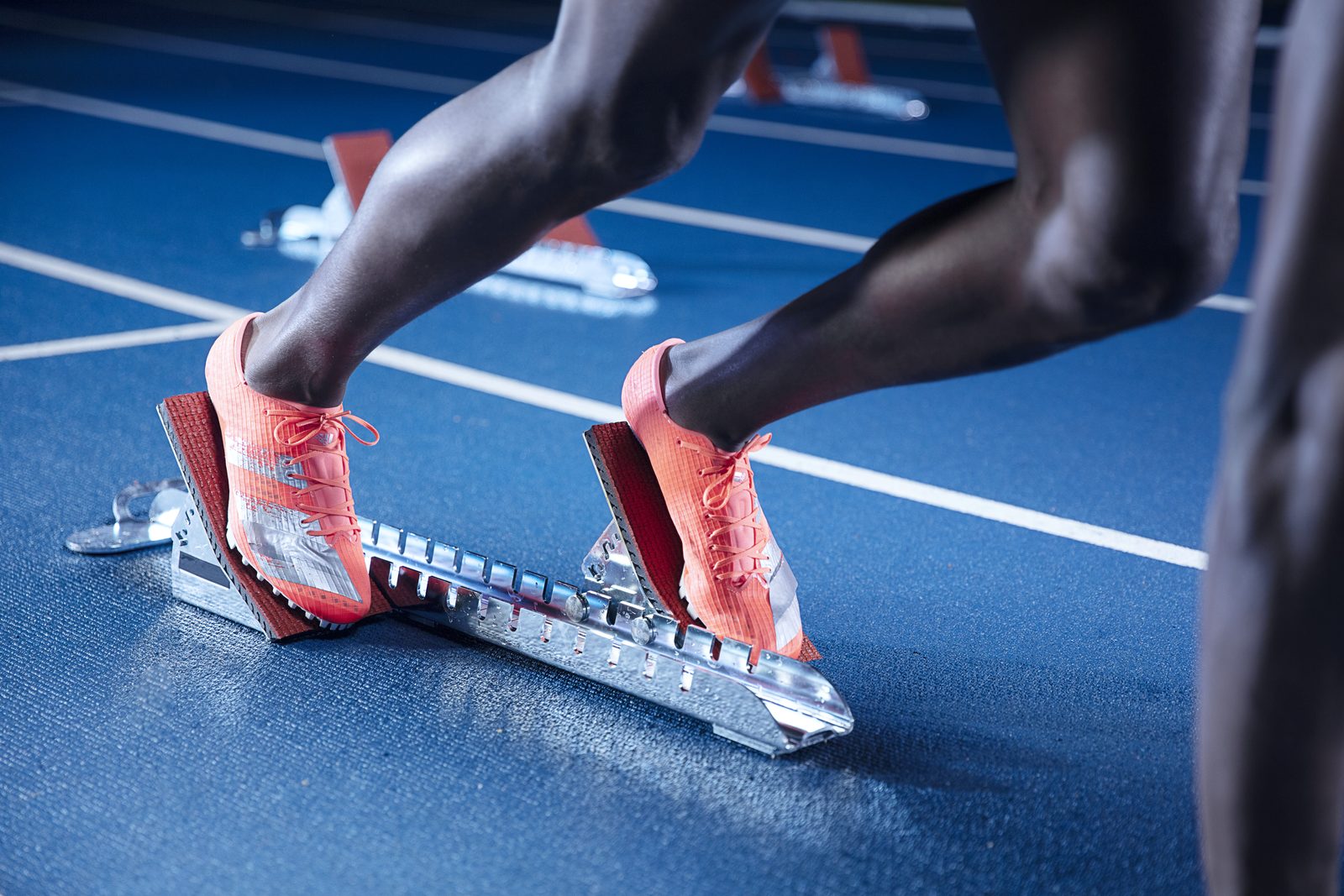 Close detail of running shoes in the blocks