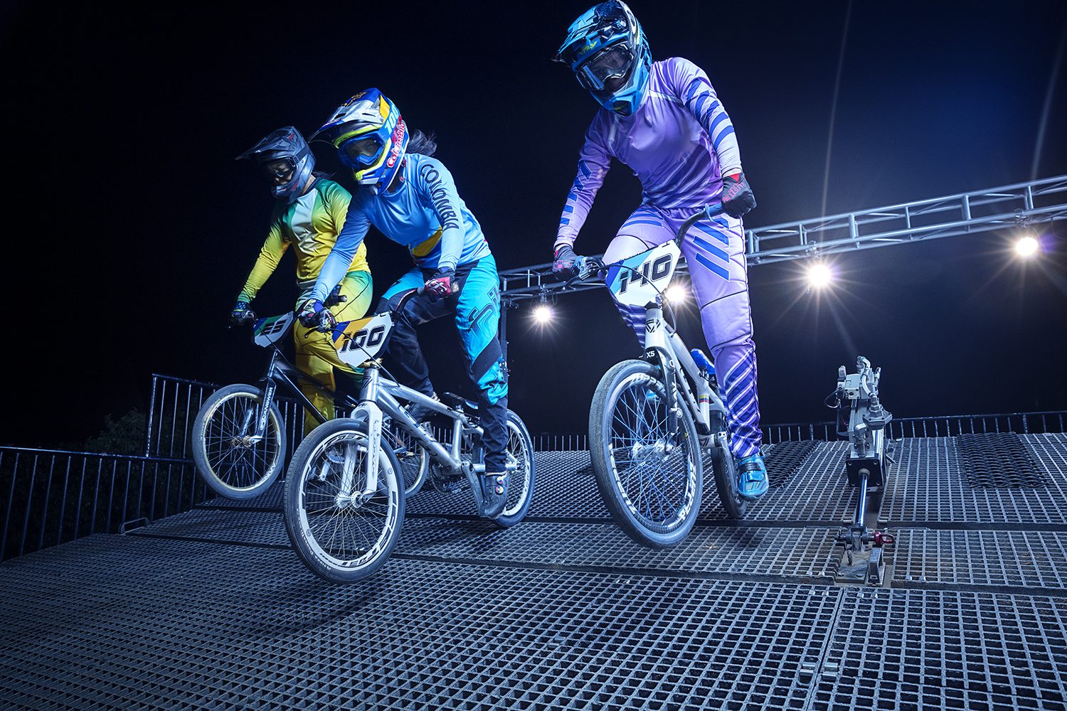 BMX riders on the start ramp with Visa branding