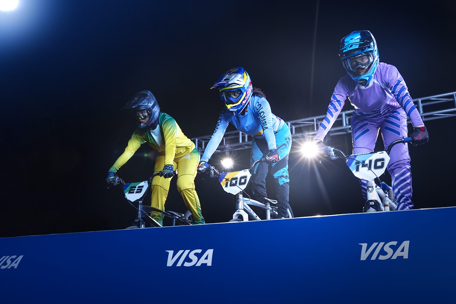 BMX racers push off the start gate