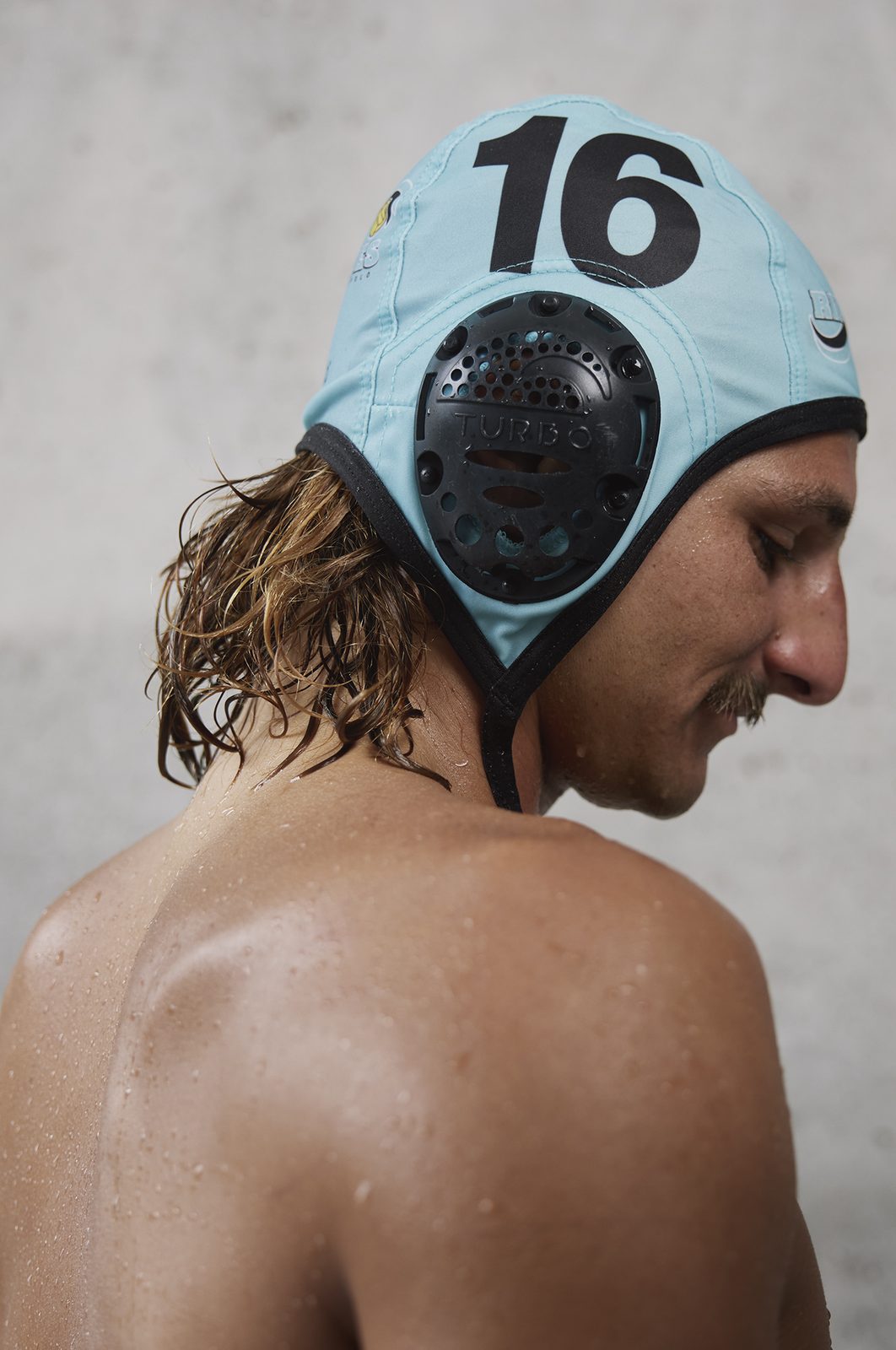 A player in a number-16 cap seen from behind